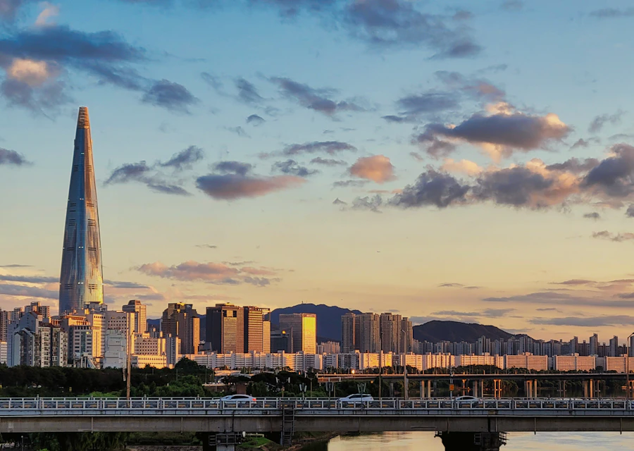 Seoul skyline with Lotte World Tower and a bridge at sunset