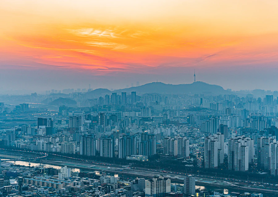 Seoul skyline and mountain backdrop at dusk