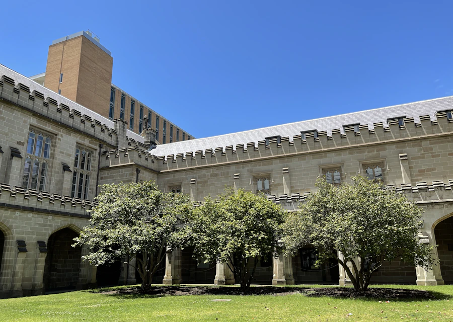 Old Quad sandstone buildings and lawn at the University of Melbourne